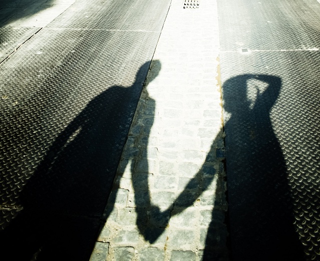 stockvault-shadow-of-a-couple-holding-hands132418