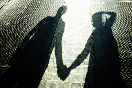 stockvault-shadow-of-a-couple-holding-hands132418